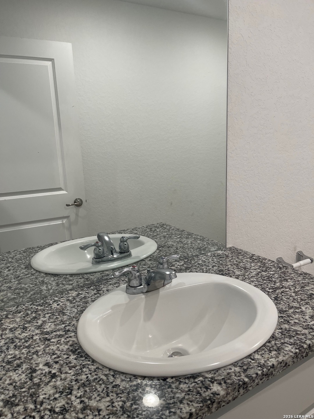 918 Cook Bend San Antonio, TX 78221 - Photo 19 of 21 a bathroom with a sink and a mirror
