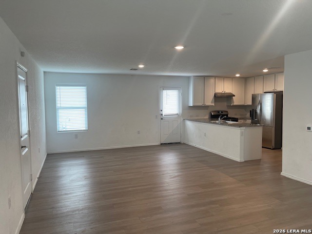 918 Cook Bend San Antonio, TX 78221 - Photo 3 of 21 a kitchen with stainless steel appliances a refrigerator sink and cabinets
