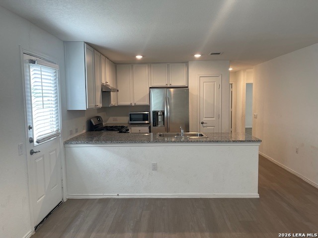 918 Cook Bend San Antonio, TX 78221 - Photo 5 of 21 a view of kitchen with stainless steel appliances granite countertop cabinets and wooden floor