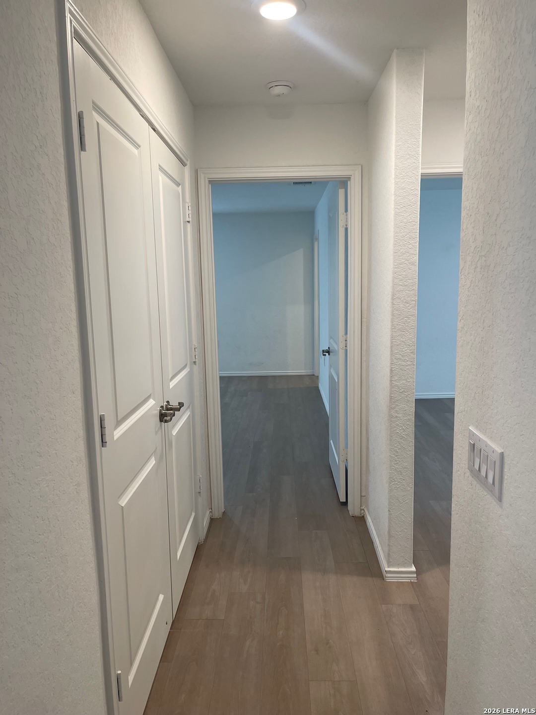 918 Cook Bend San Antonio, TX 78221 - Photo 8 of 21 a view of a hallway with wooden floor