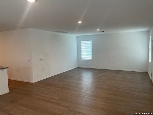 918 Cook Bend San Antonio, TX 78221 - Photo 9 of 21 an empty room with wooden floor and windows