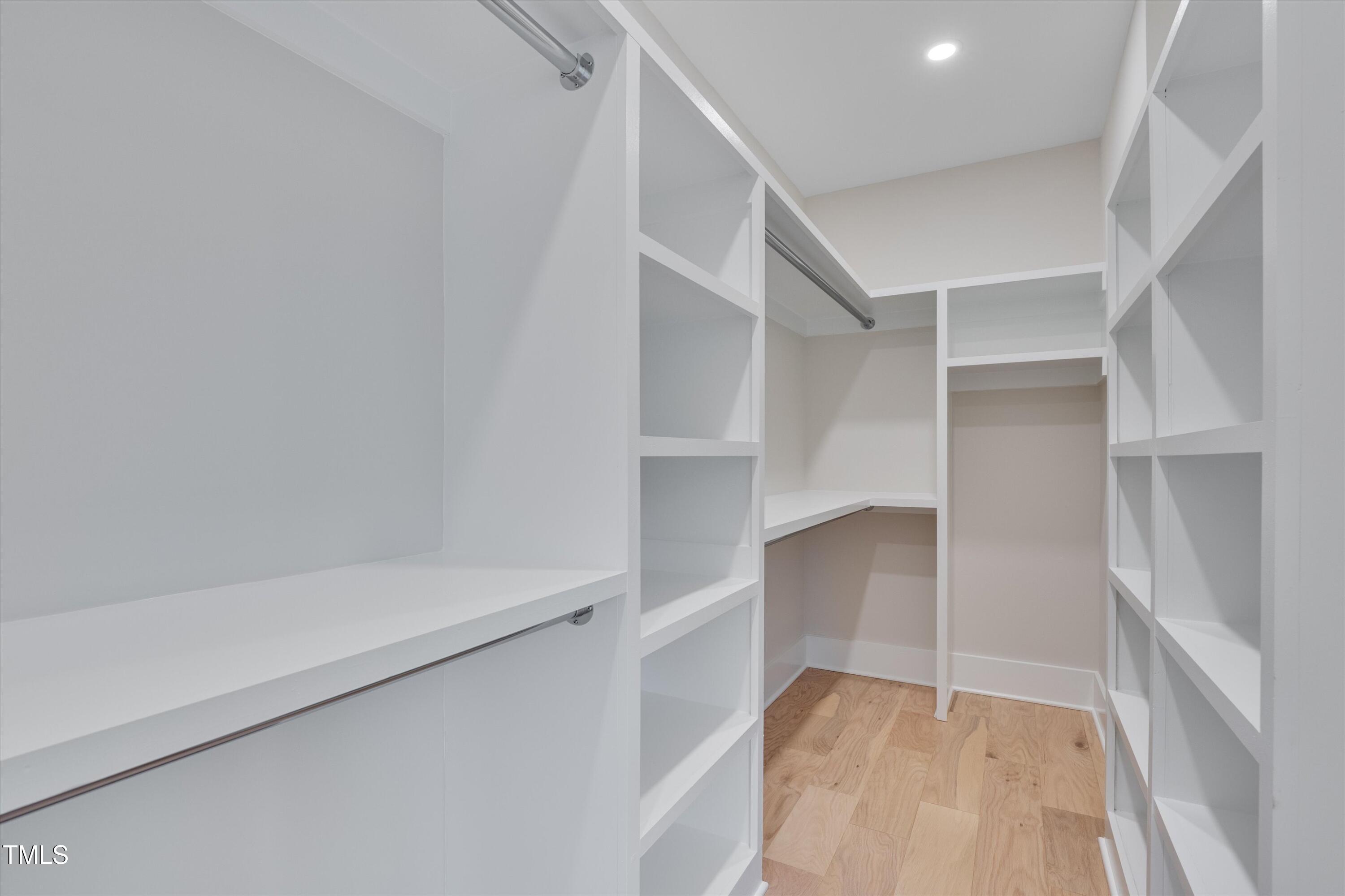 779 Willard Street Durham, NC 27701 - Photo 13 of 32 a view of walk in closet with empty racks