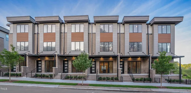 a view of a building with a yard