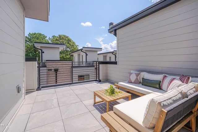 a patio with patio couch and table