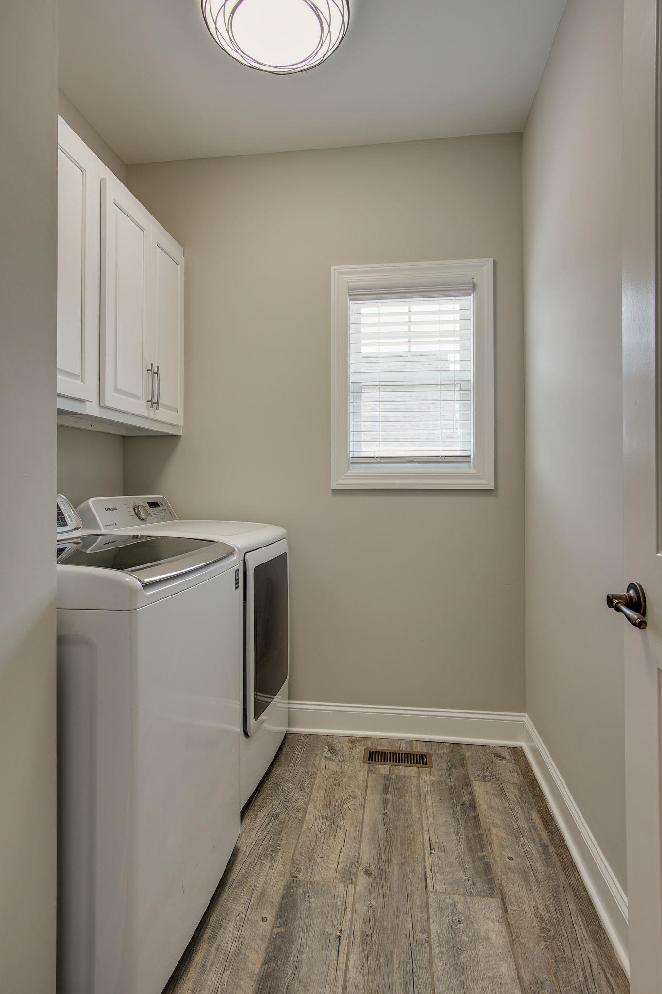 3029 Briley Path Columbia, TN 38401 - Photo 14 of 28 a utility room with wooden floor washer and dryer