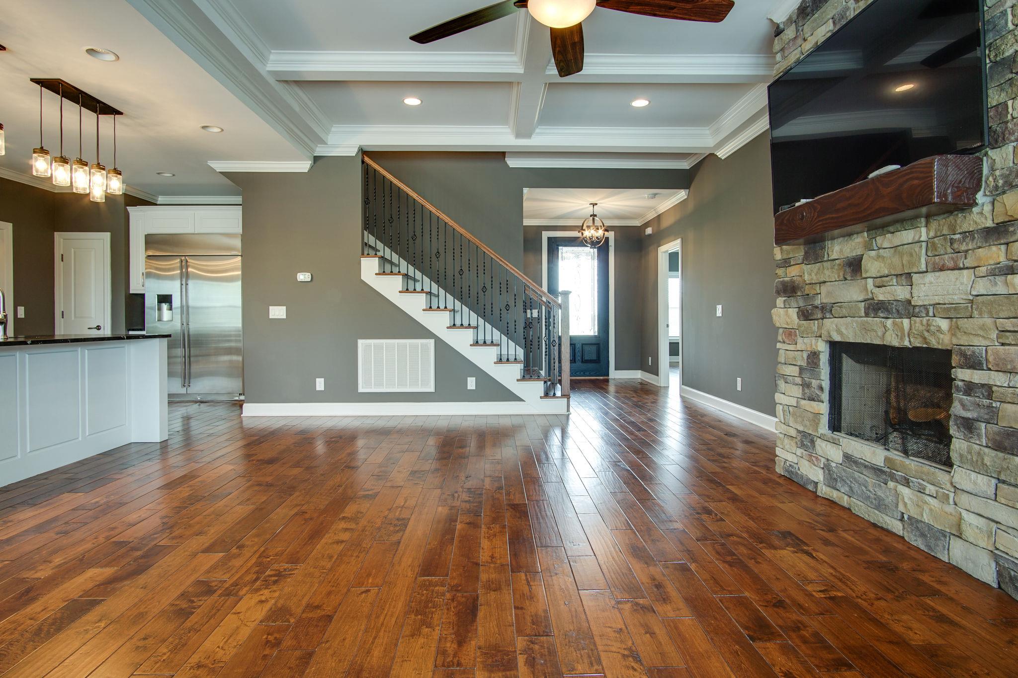 3029 Briley Path Columbia, TN 38401 - Photo 16 of 28 a view of a hallway with wooden floor and a kitchen