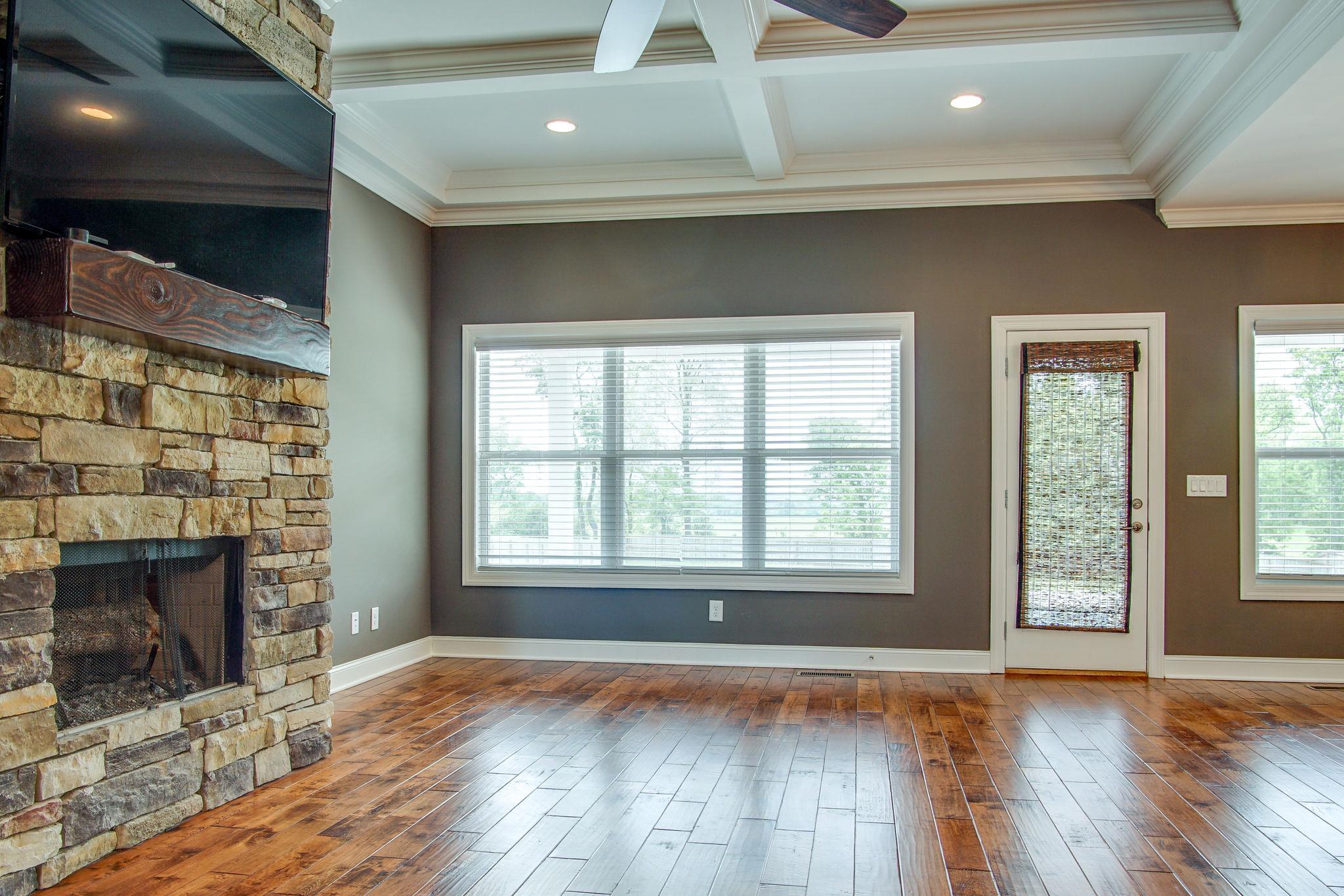 3029 Briley Path Columbia, TN 38401 - Photo 17 of 28 an empty room with wooden floor and fireplace