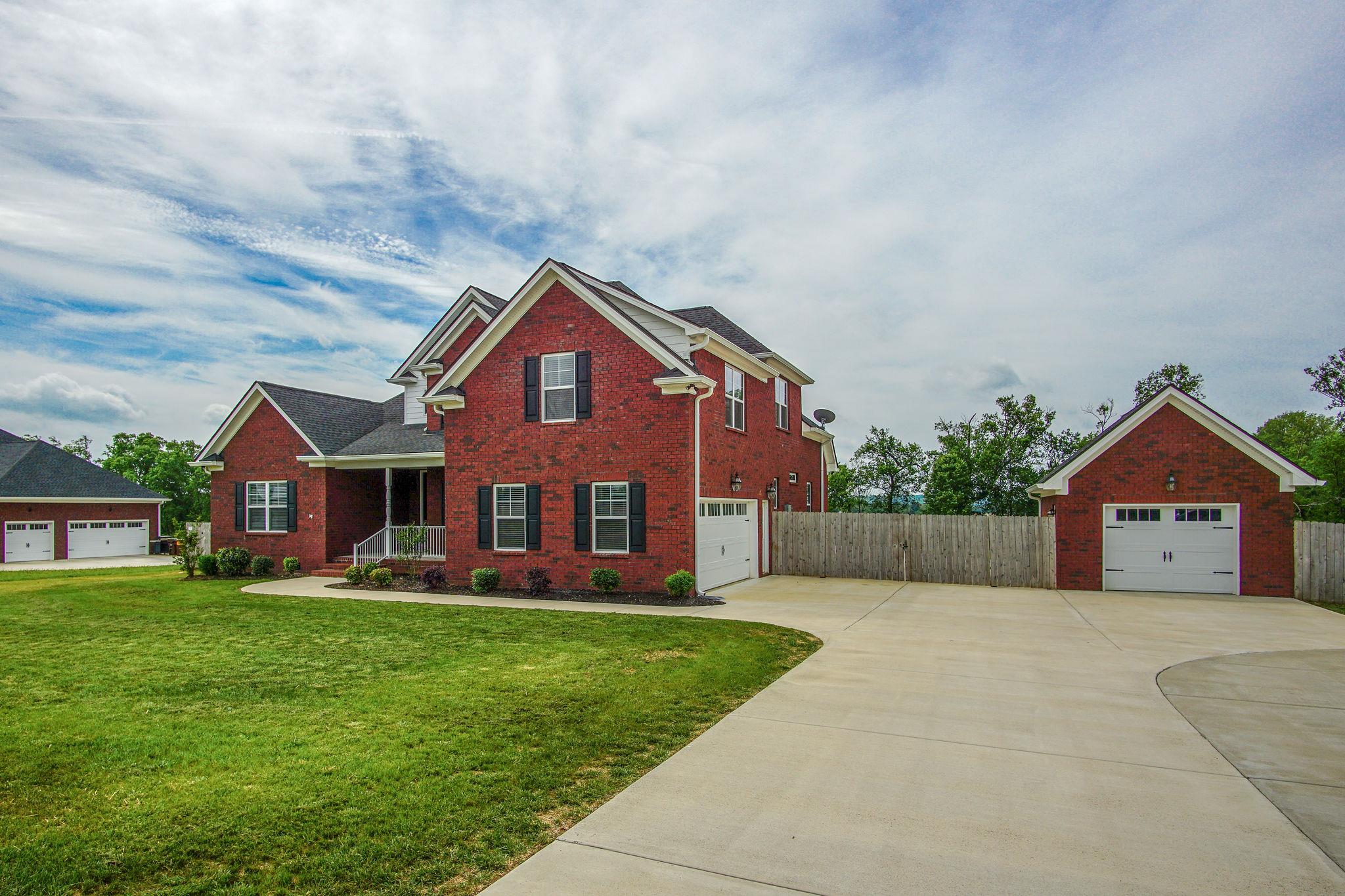 3029 Briley Path Columbia, TN 38401 - Photo 2 of 28 a front view of a house with a yard and garage