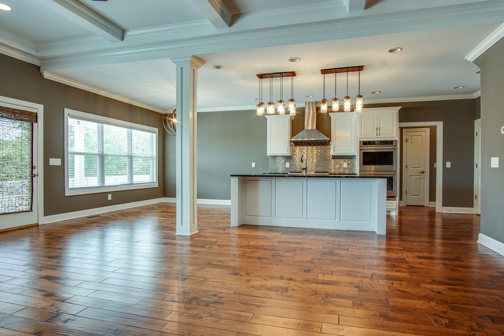 3029 Briley Path Columbia, TN 38401 - Photo 9 of 28 a large kitchen with granite countertop a large counter top stainless steel appliances and wooden floor