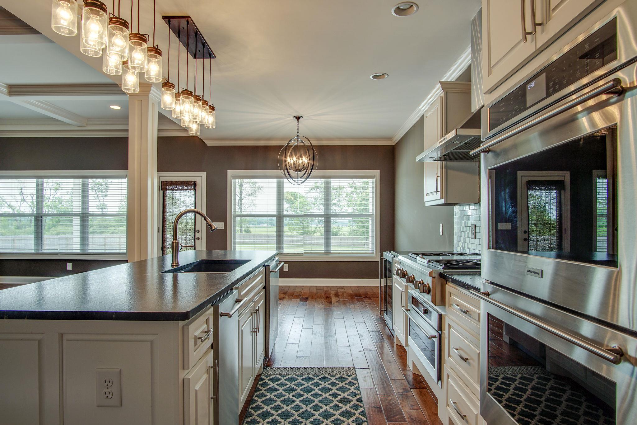 3029 Briley Path Columbia, TN 38401 - Photo 10 of 28 a kitchen with granite countertop a stove and a sink