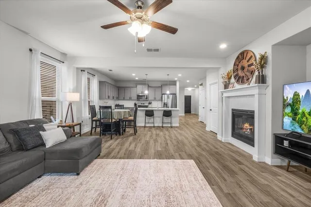 a living room with furniture and a fireplace