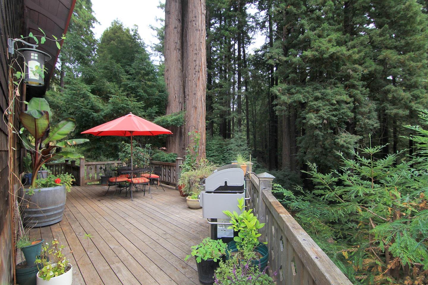6360 Glen Haven Road Soquel, CA 95073 - Photo 18 of 50 an outdoor space with furniture and umbrella