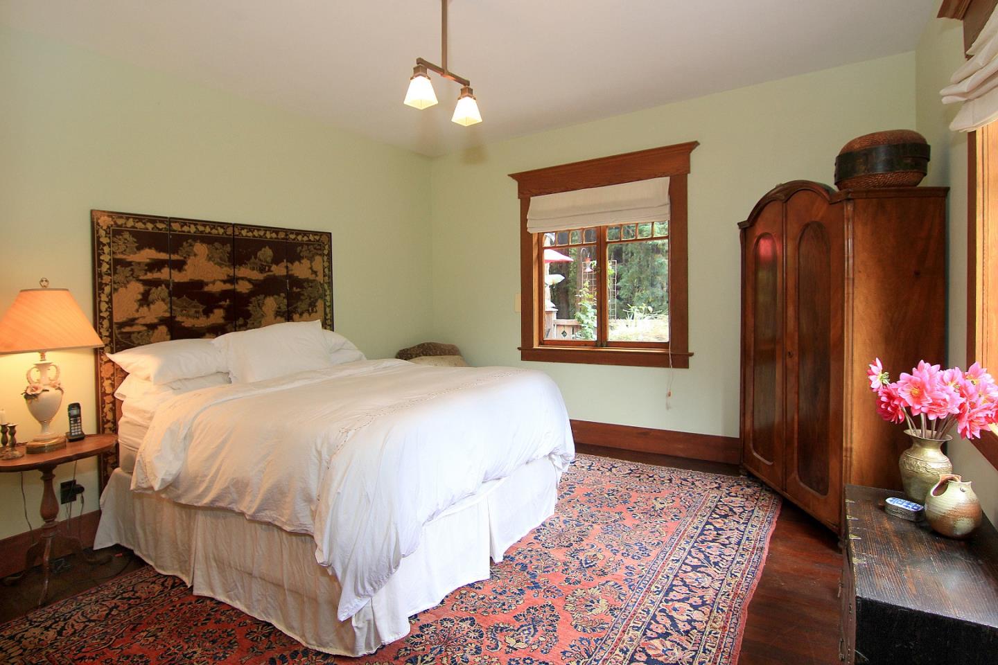 6360 Glen Haven Road Soquel, CA 95073 - Photo 20 of 50 a bedroom with a bed and wooden floor