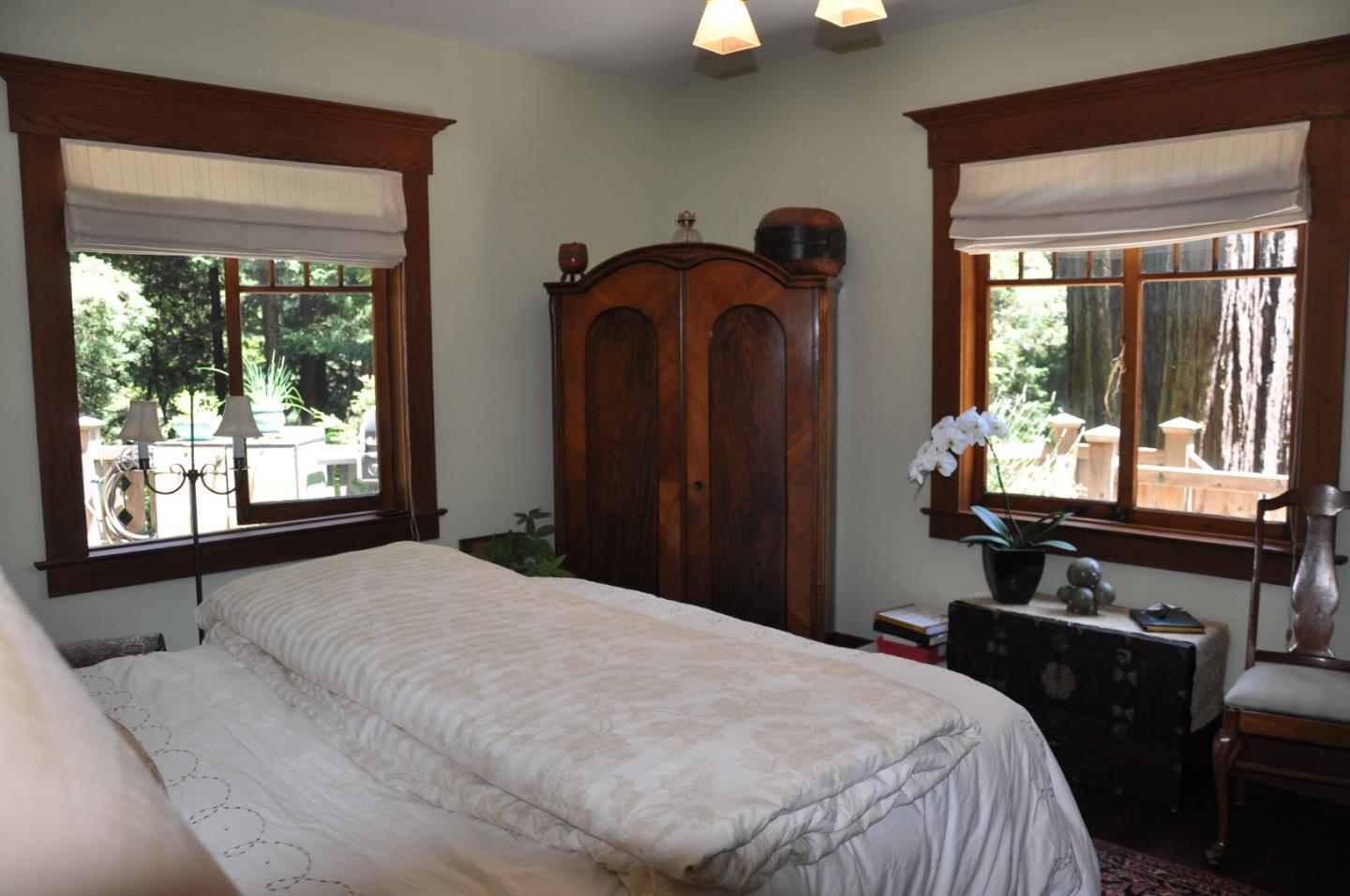6360 Glen Haven Road Soquel, CA 95073 - Photo 21 of 50 a bedroom with bed and large windows