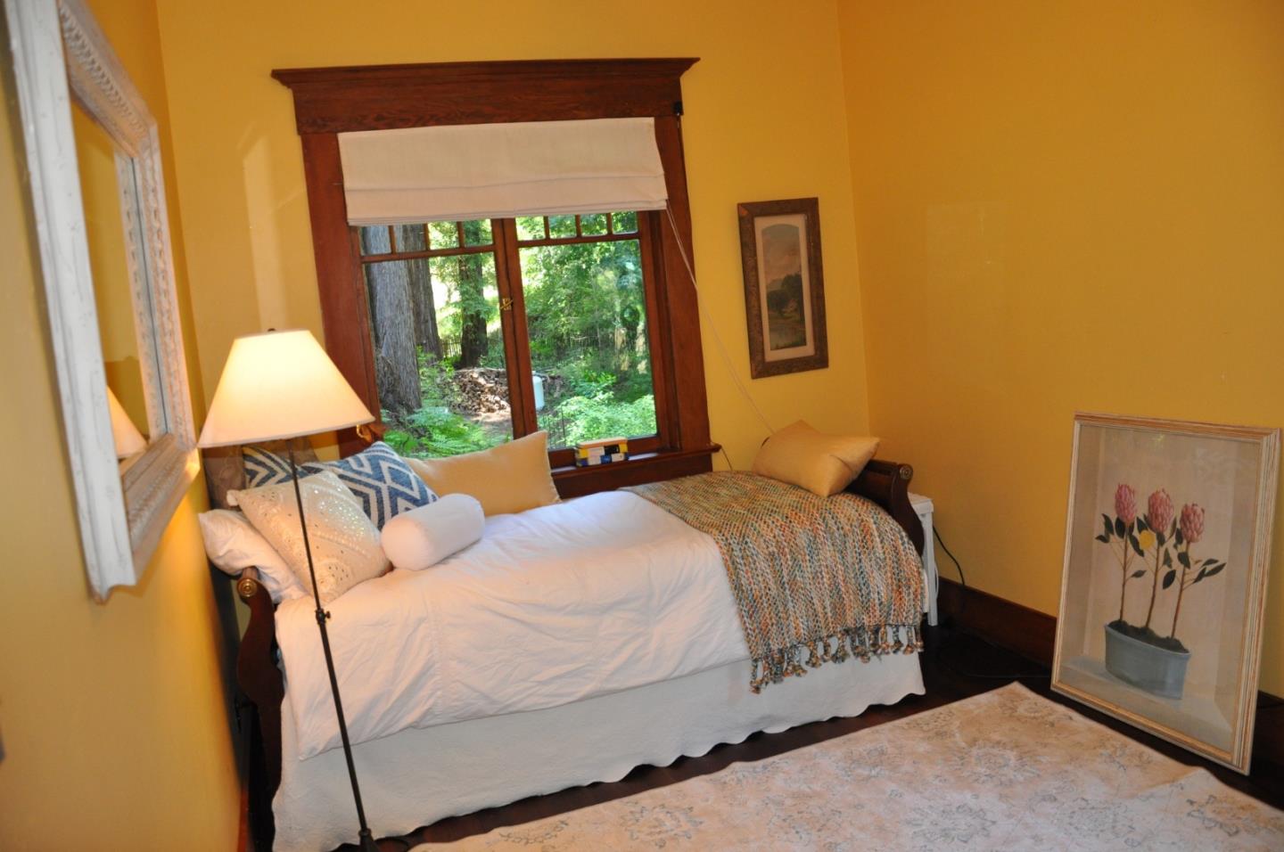 6360 Glen Haven Road Soquel, CA 95073 - Photo 25 of 50 a bedroom with a bed and a window