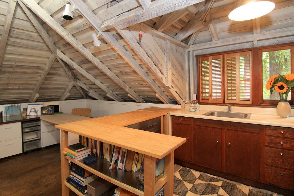 6360 Glen Haven Road Soquel, CA 95073 - Photo 35 of 50 a kitchen with a sink and wooden cabinets