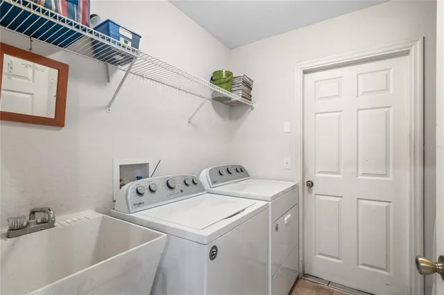 a utility room with dryer and washer