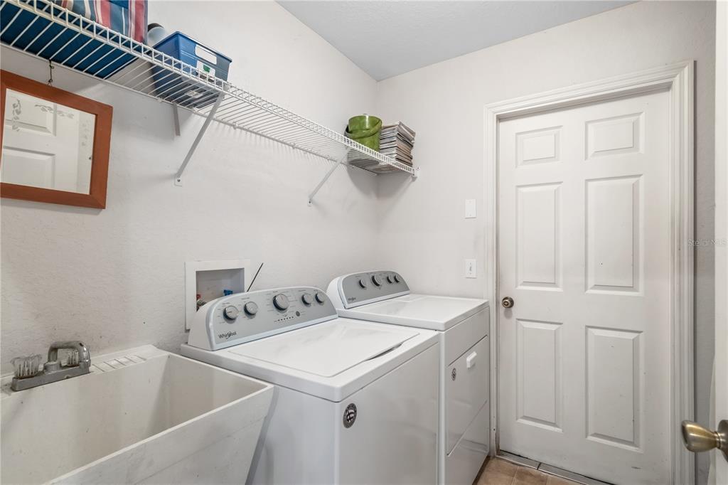 67 Lake Diamond Boulevard Ocala, FL 34472 - Photo 11 of 32 a utility room with dryer and washer