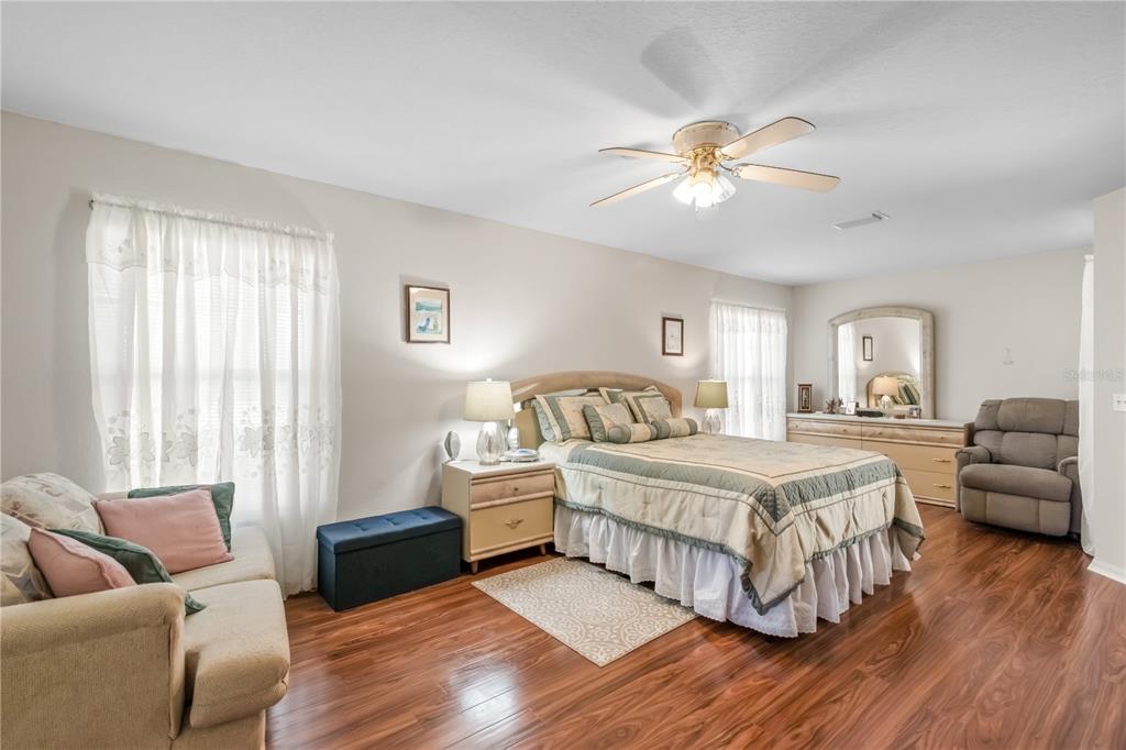 67 Lake Diamond Boulevard Ocala, FL 34472 - Photo 14 of 32 a bedroom with a bed and a couch