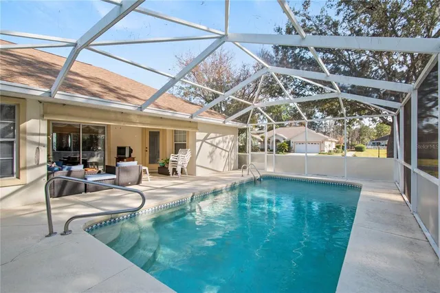 a view of a swimming pool with a patio