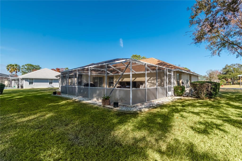 67 Lake Diamond Boulevard Ocala, FL 34472 - Photo 27 of 32 a view of a house with a big yard
