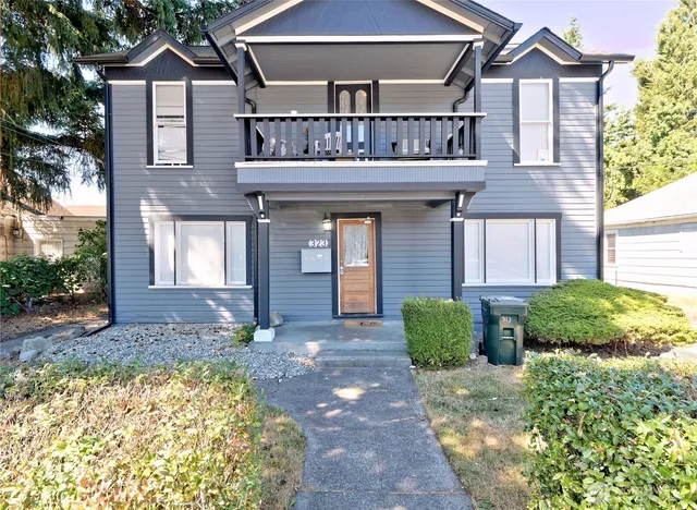 a front view of a house with garden