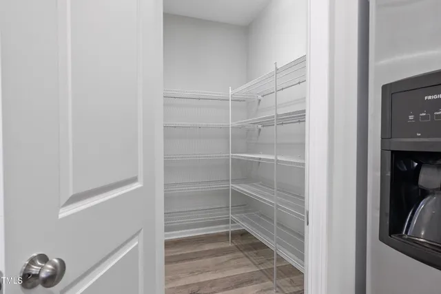 a swimming pool with an outdoor space and seating area