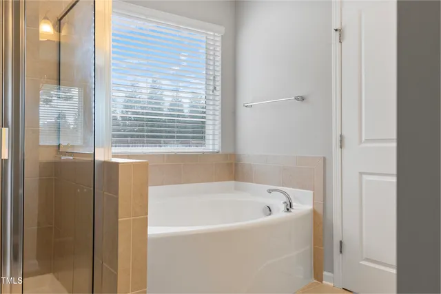 a view of an empty room and closet area