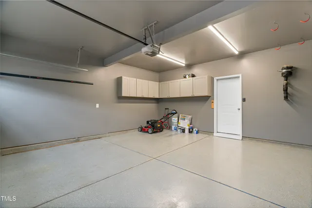 a view of a storage & utility room with two washing machine