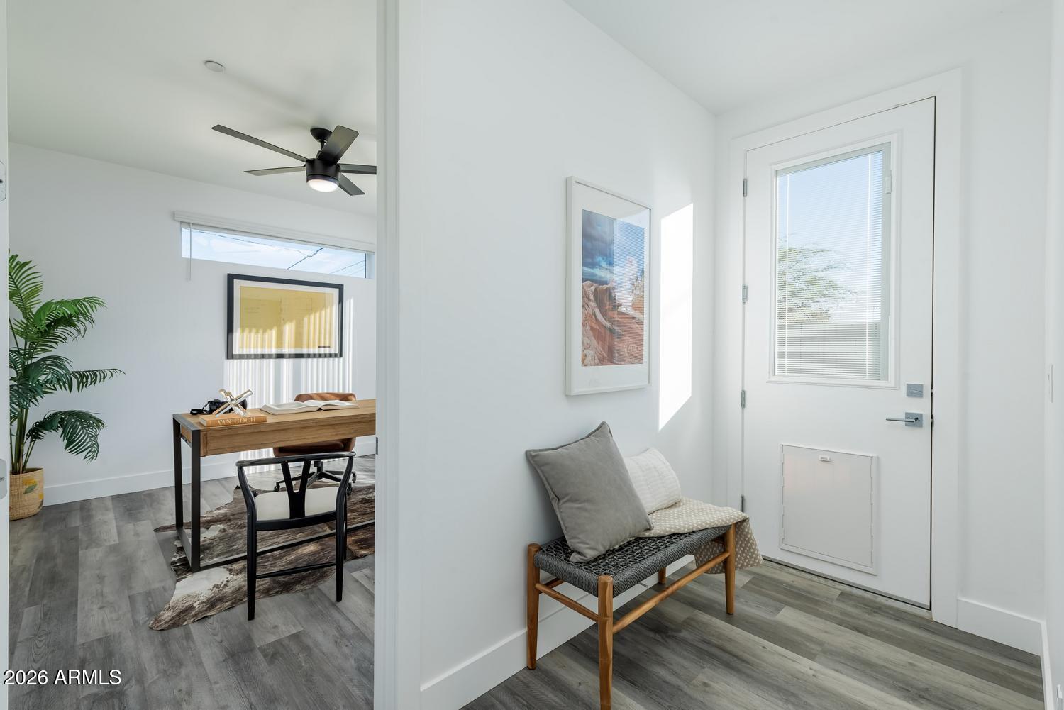 1349 West Osborn Road, Unit 6 Phoenix, AZ 85013 - Photo 12 of 37 a living room with furniture a table and wooden floor