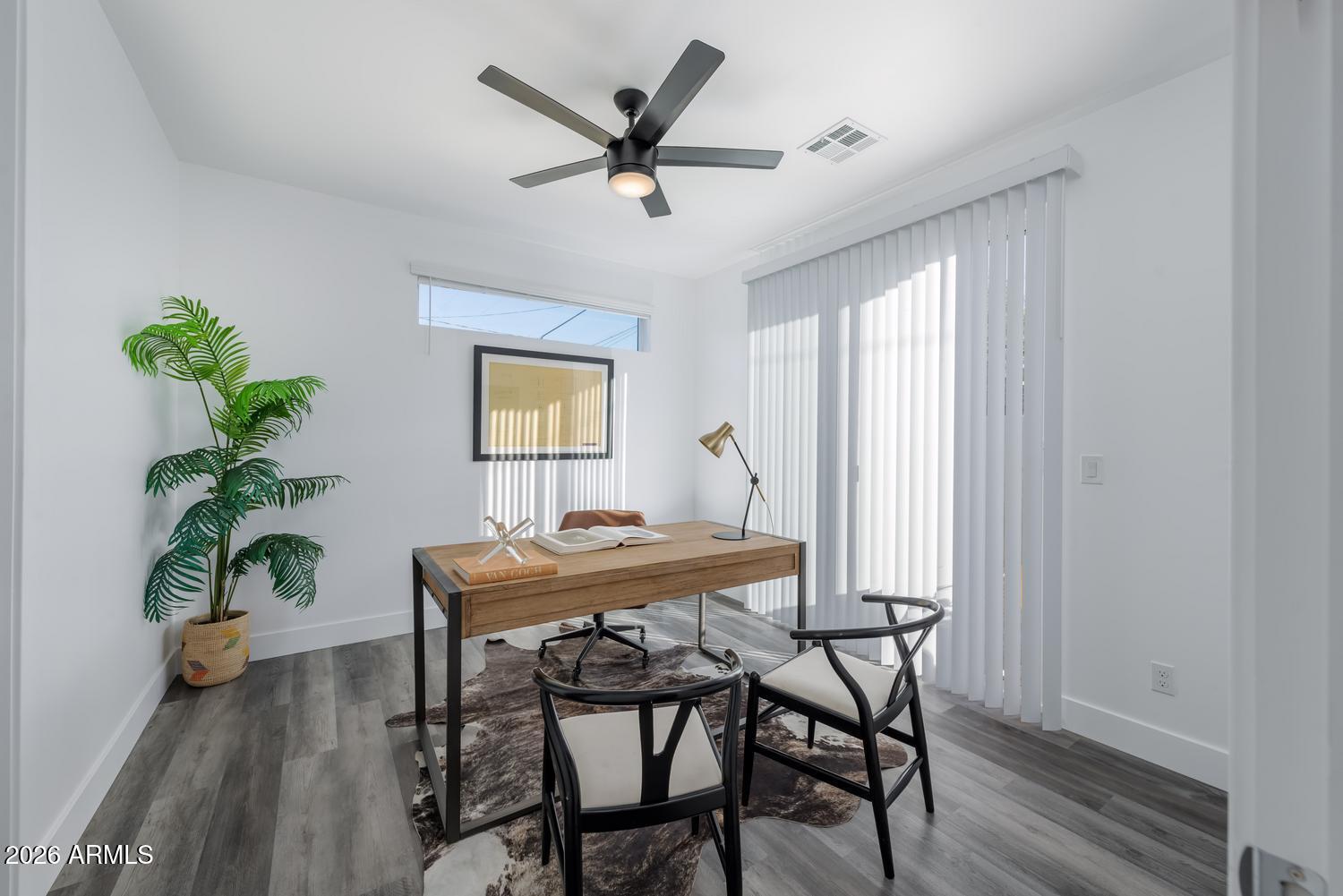 1349 West Osborn Road, Unit 6 Phoenix, AZ 85013 - Photo 13 of 37 a view of a dining room with furniture window and wooden floor