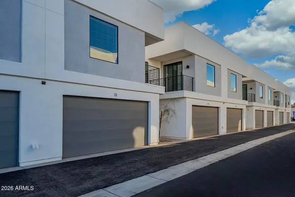 a front view of a house with a garage