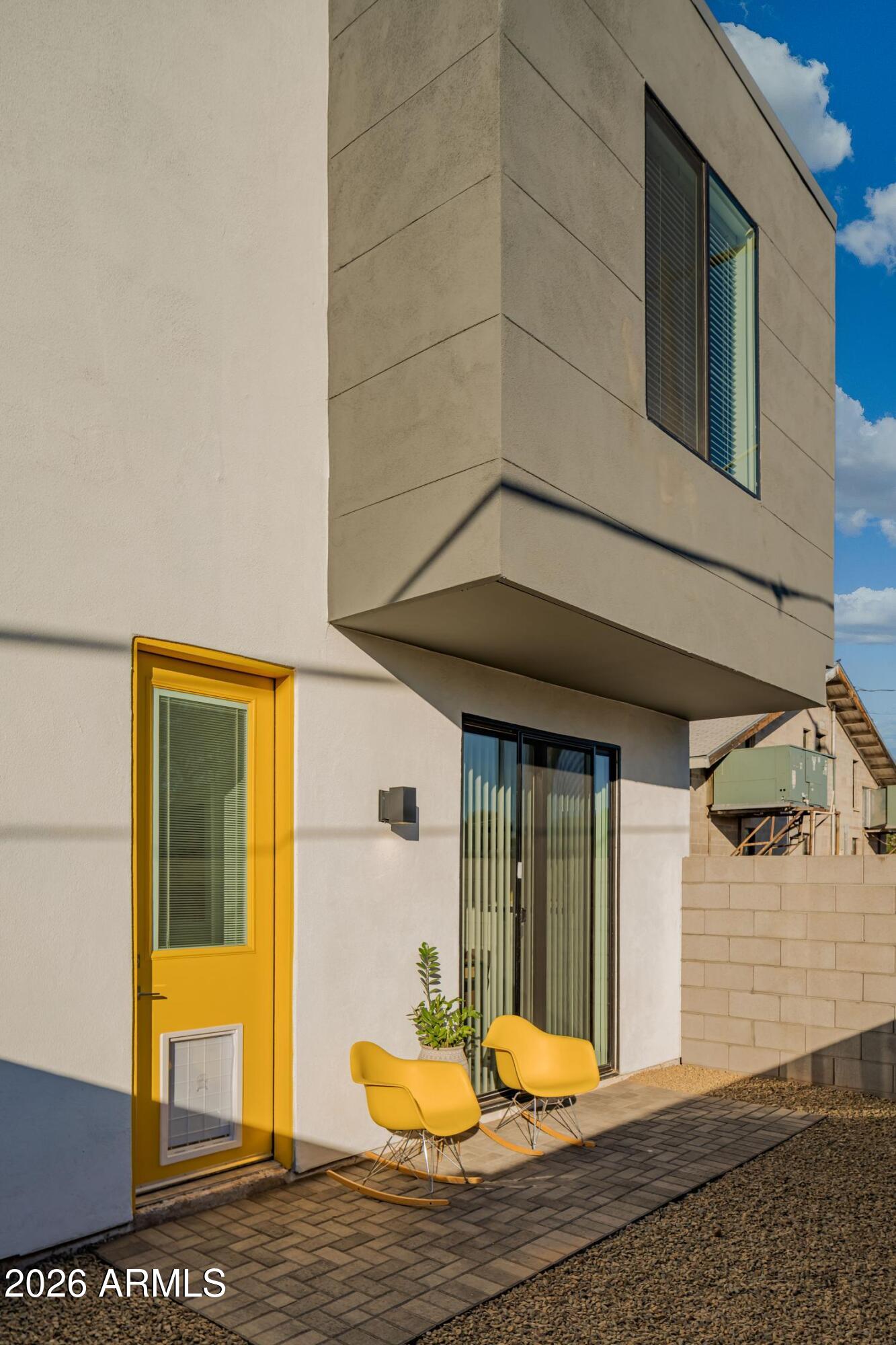 1349 West Osborn Road, Unit 6 Phoenix, AZ 85013 - Photo 23 of 37 a front view of a house with a yard
