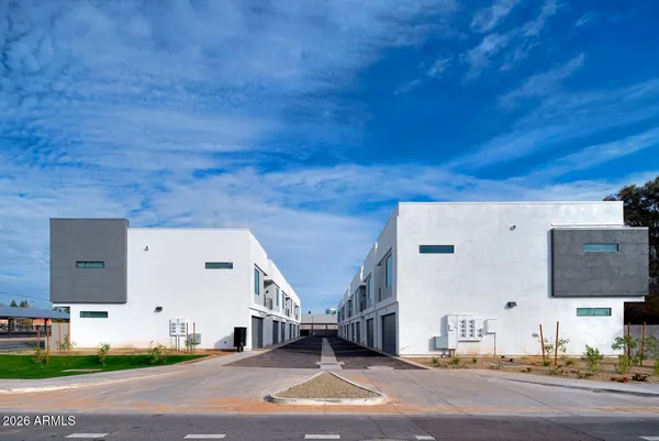 a view of a building with a street