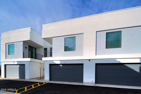a view of street with big house