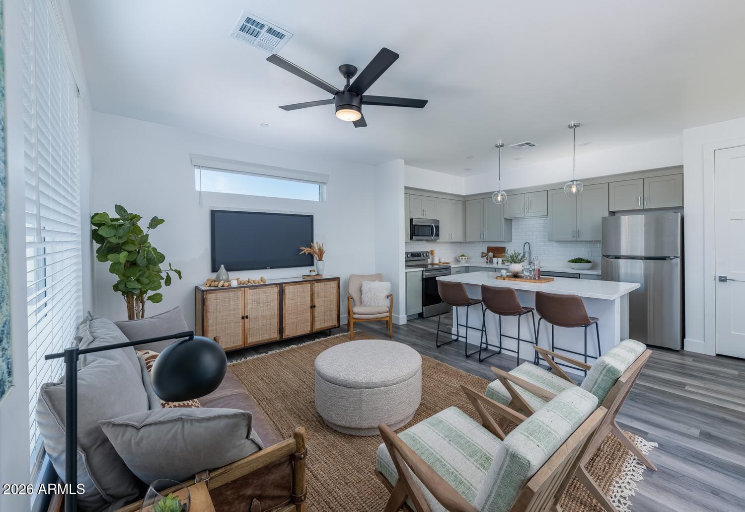 1349 West Osborn Road, Unit 6 Phoenix, AZ 85013 - Photo 5 of 37 a living room with furniture and a flat screen tv