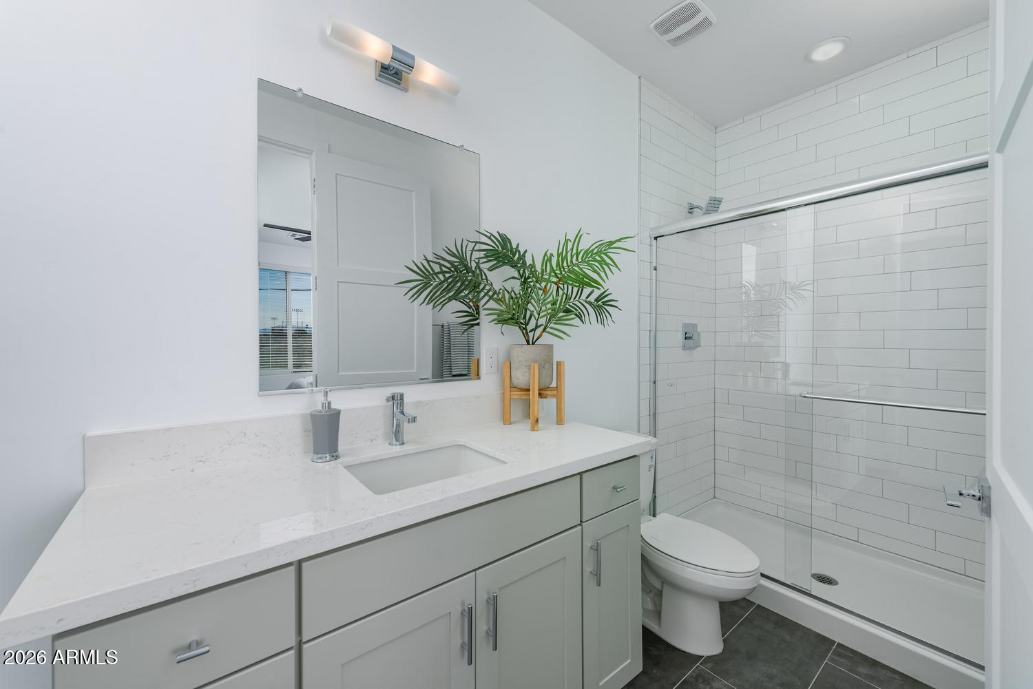 1349 West Osborn Road, Unit 6 Phoenix, AZ 85013 - Photo 8 of 37 a bathroom with a sink a toilet and shower