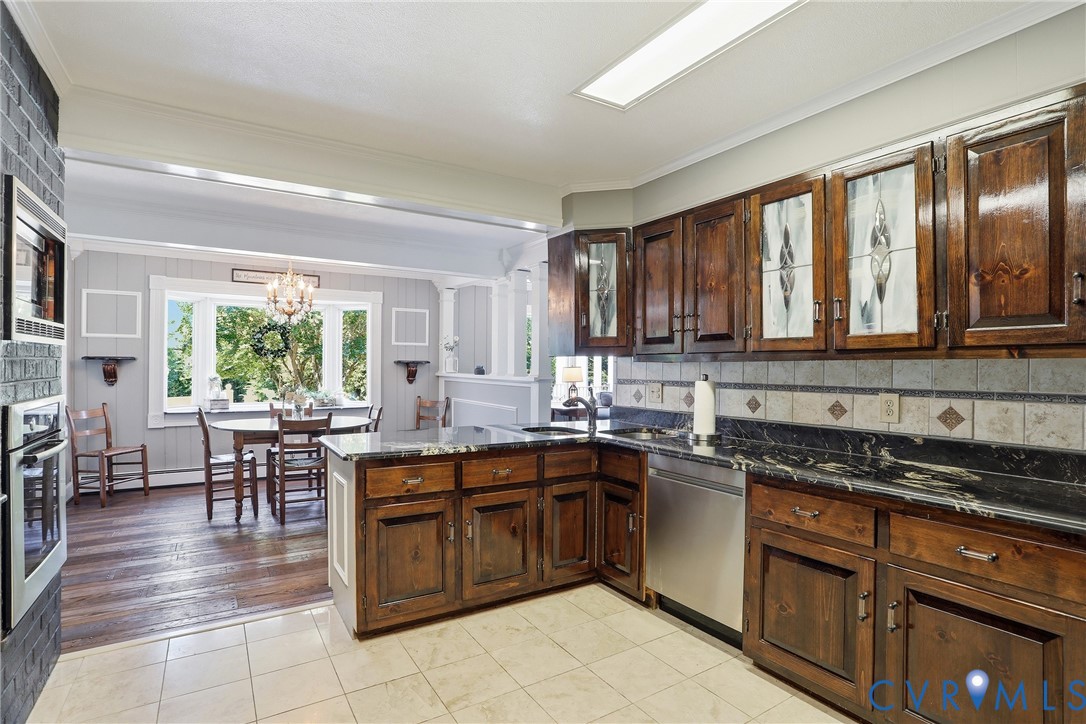 13300 West Patrick Henry Road Doswell, VA 23047 - Photo 12 of 69 Kitchen featuring wood cabinetry, stainless steel
