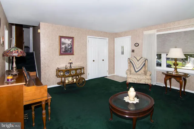 a living room with furniture and a table