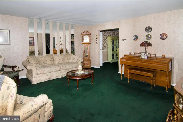 a living room with furniture and a table