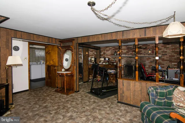 a room with lots of wooden furniture and shower