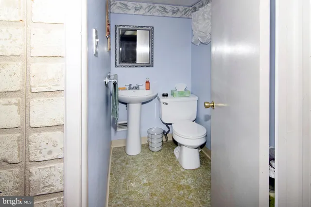 a bedroom with a bed and a television