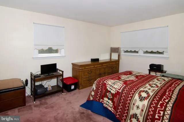 a bedroom with a bed and furniture