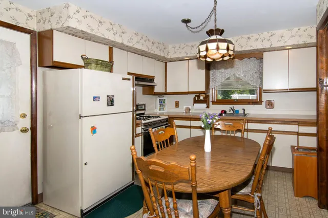 a bedroom with a bed closet and a mirror