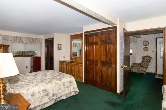 a bathroom with a tub sink and a shower