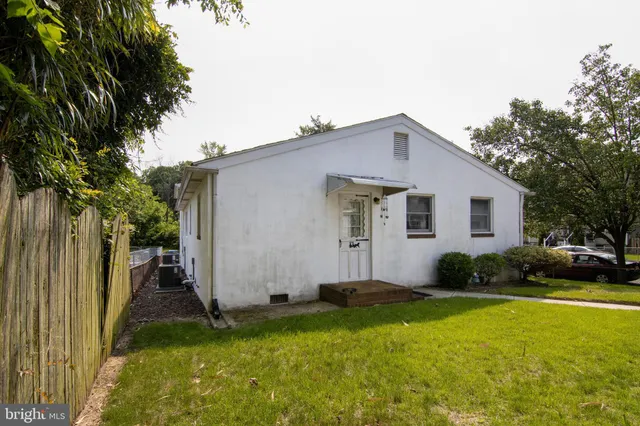 a view of a swimming pool and trees in the background
