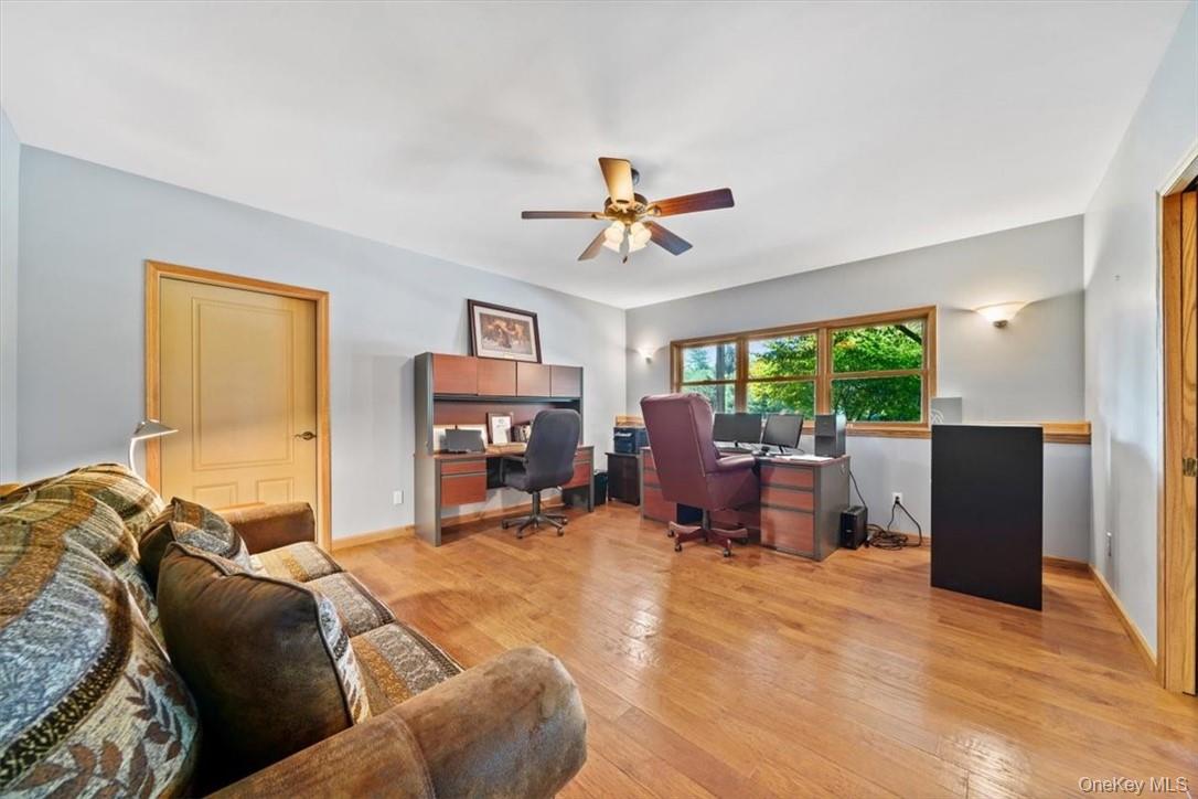 1038 Milanville Road Beach Lake, PA 18405 - Photo 18 of 36 a bed room with a bed and a chair