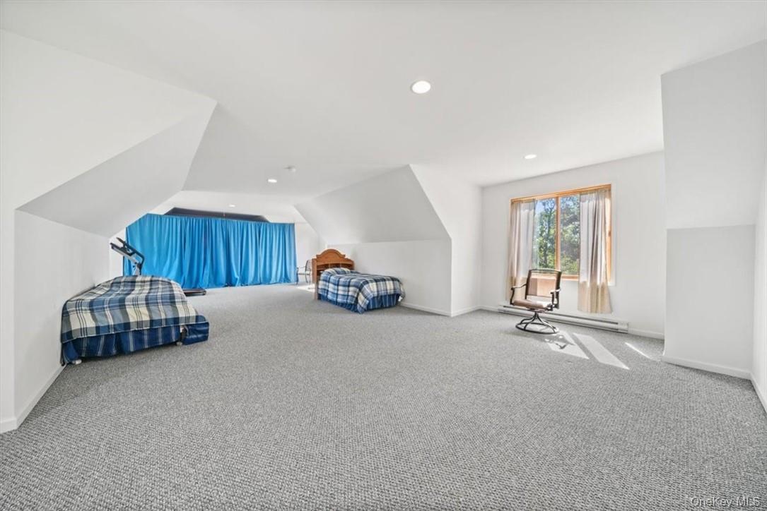 1038 Milanville Road Beach Lake, PA 18405 - Photo 23 of 36 a room with a bed and a window