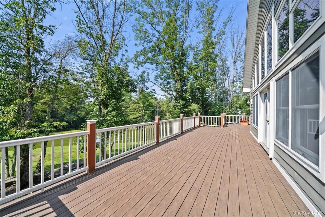 1038 Milanville Road Beach Lake, PA 18405 - Photo 25 of 36 a view of balcony with wooden floor and fence