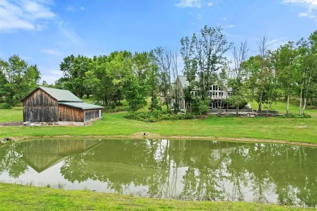 a view of a lake with a building in the background